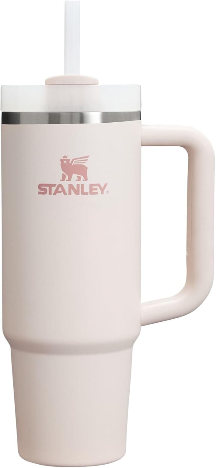 Stanley Quencher H2.0 Tumbler in Rose Quartz 2.0, 30 oz, with handle, straw, and Flowstate lid, perfect for travel.